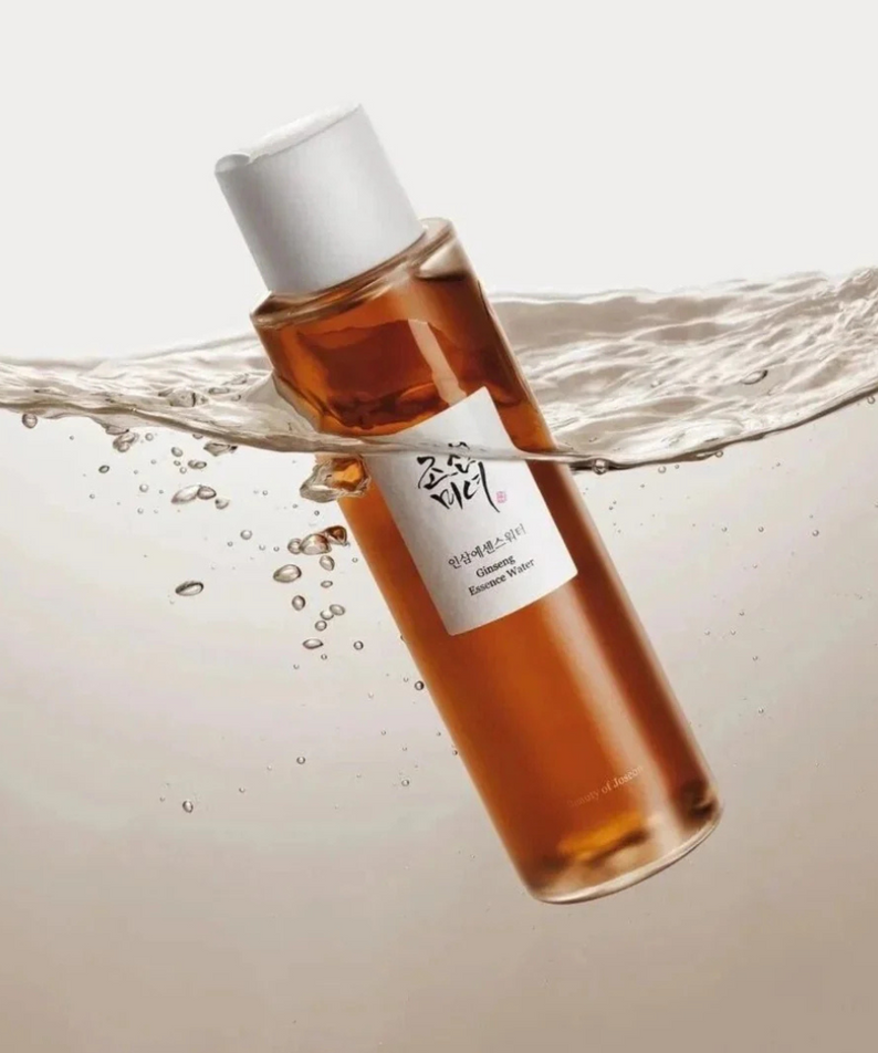 BEAUTY OF JOSEON Ginseng Essence Water 150ml : flacon ambré et éclaboussures d’eau sur fond blanc, marque en évidence.