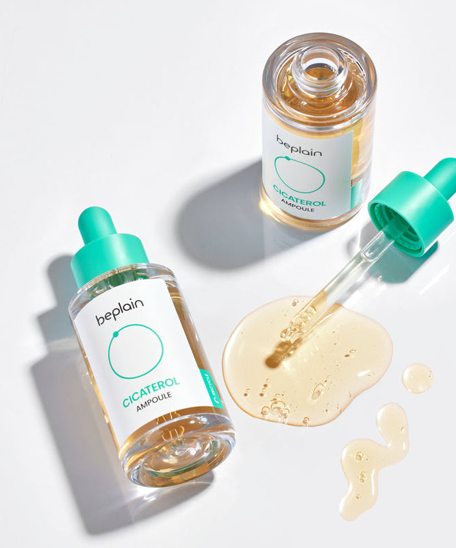 BEPLAIN Cicaterol Ampoule 30ml de la marque Beplain : flacons verts et sérum liquide sur fond blanc, contexte beauté