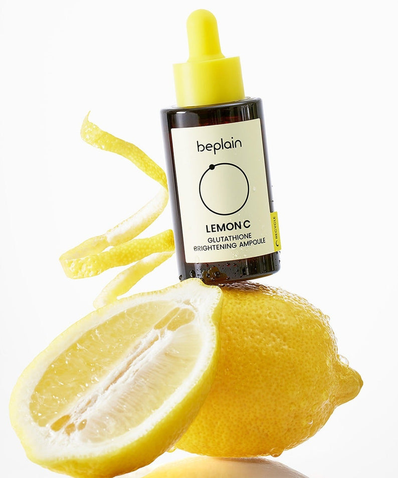 BEPLAIN Lemon Seed Glutathione Whitenning Ampoule 30ml de beplain avec citron et gouttes jaunes, fond blanc, produit éclaircissant