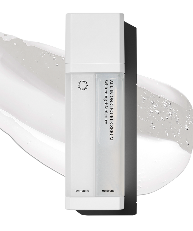 BLACK MONSTER White All-in-One Double Serum 75ml, sérum double en flacon blanc sur fond crème, gouttes lumineuses.