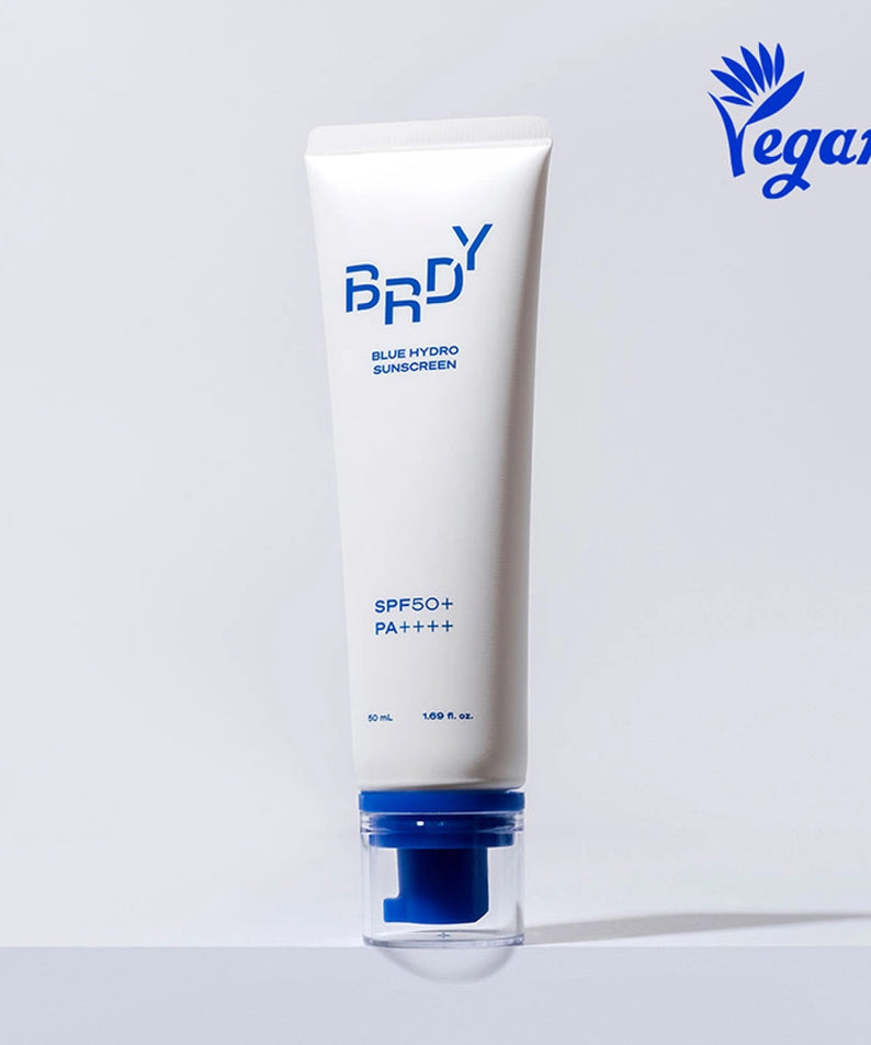 B.READY Blue Moisture Sun Cream SPF50+/PA++++ 50ml, tube bleu sur fond clair, marque BE.READY en contexte skincare.
