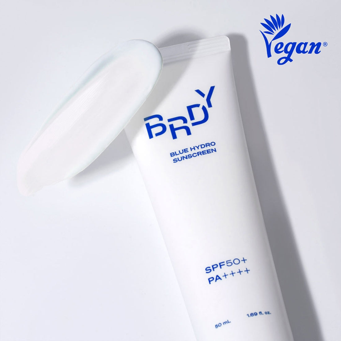 B.READY Blue Moisture Sun Cream SPF50+/PA++++ 50ml, crème solaire hydratante BE.READY en tube bleu sur fond clair.
