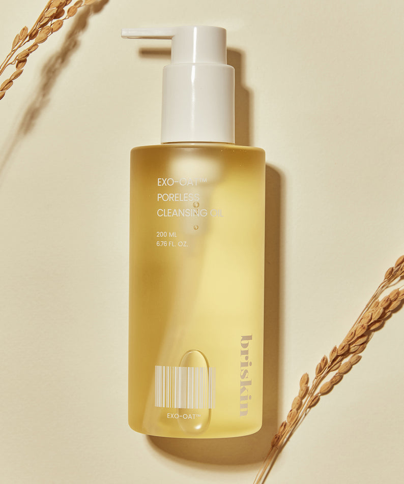 BRISKIN Exo-Oat Poreless Cleansing Oil 200ml, huile nettoyante visage sur fond beige avec épis, 200ml bouteille élégante.