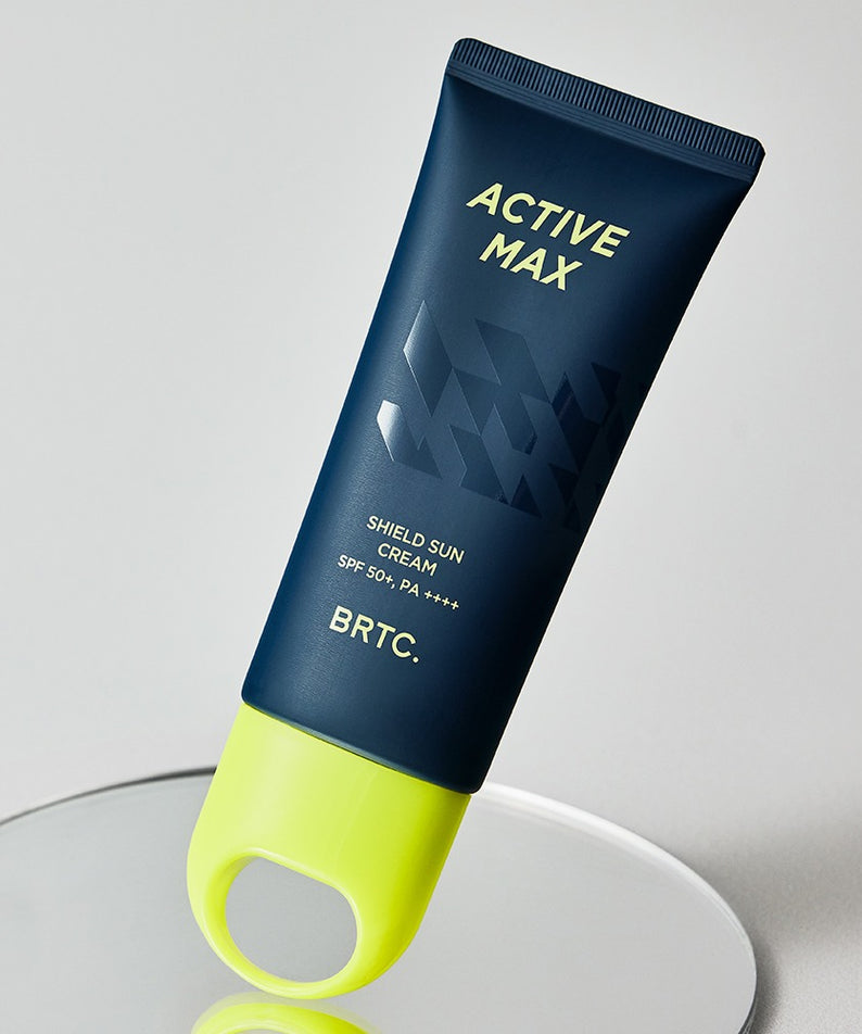 BRTC Homme Active Max Sheild Sunscreen 50ml de BRTC, tube bleu et vert sur fond clair, crème solaire SPF50+
