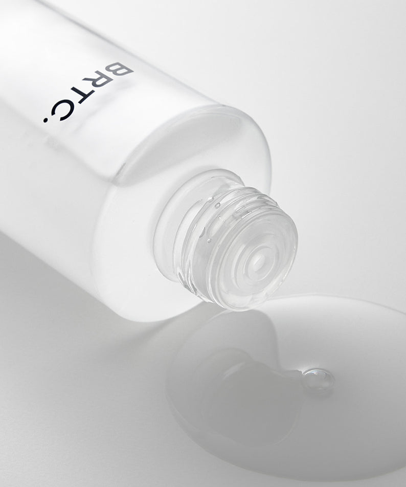BRTC The First Essence 120ml en flacon transparent, liquide renversé, soin visage essentiel.