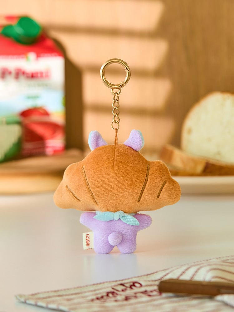 BT21 MANG BABY PLUSH KEYRING BAKERY SHOP : porte-clés MANG en peluche devant accessoires de boulangerie, style K-pop LINE FRIENDS