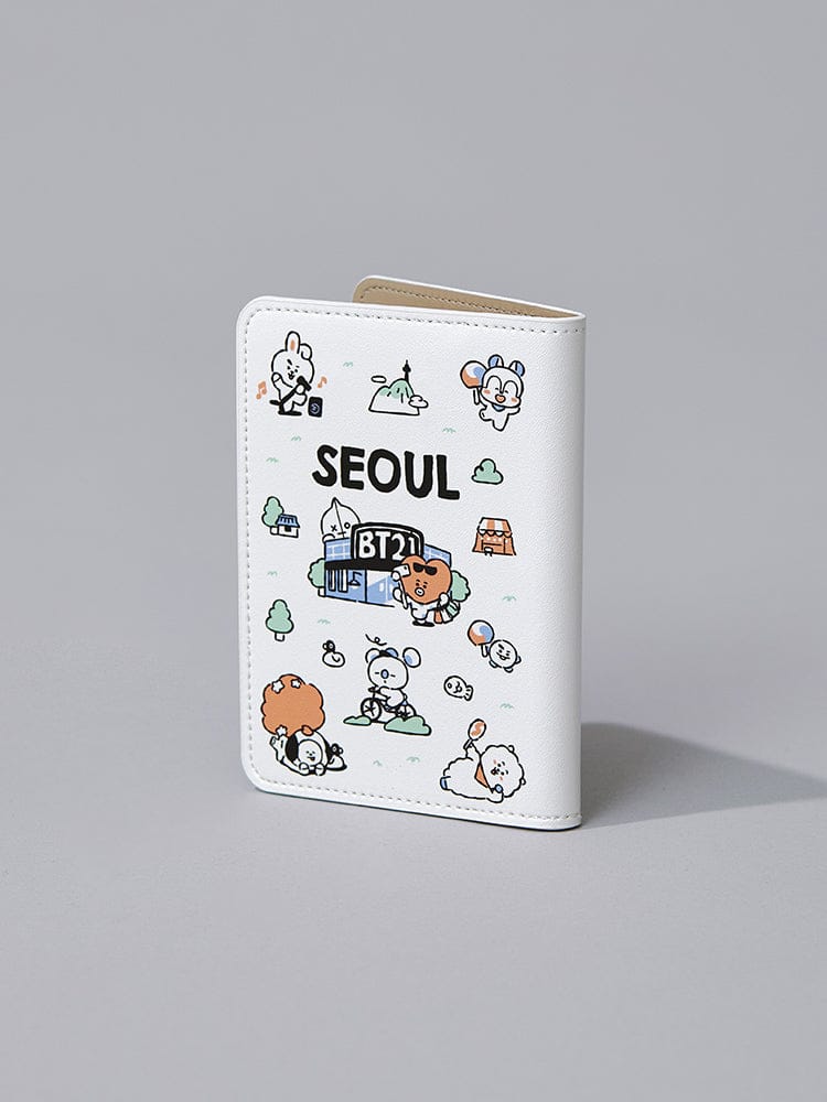 BT21 PASSPORT COVER SEOUL EDITION : couverture passeport blanche avec personnages LINE FRIENDS et inscription SEOUL, sur fond gris.