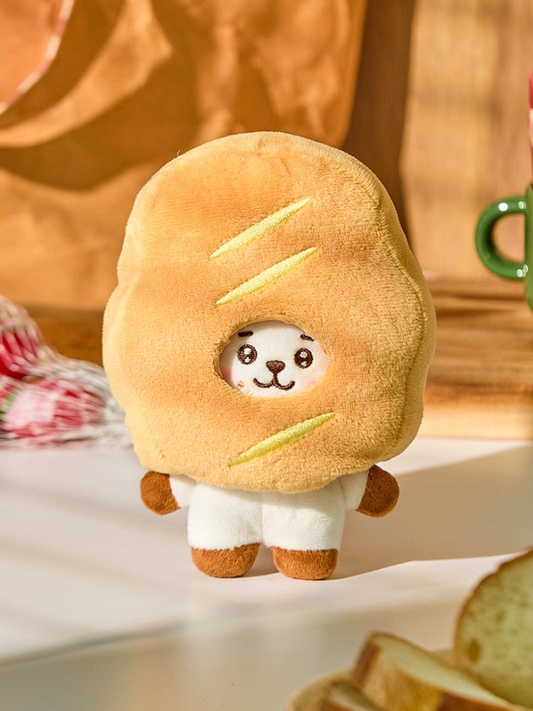 BT21 RJ BABY COSTUME PLUSH DOLL BAKERY SHOP, peluche officielle LINE représentant RJ en tenue boulanger sur décor