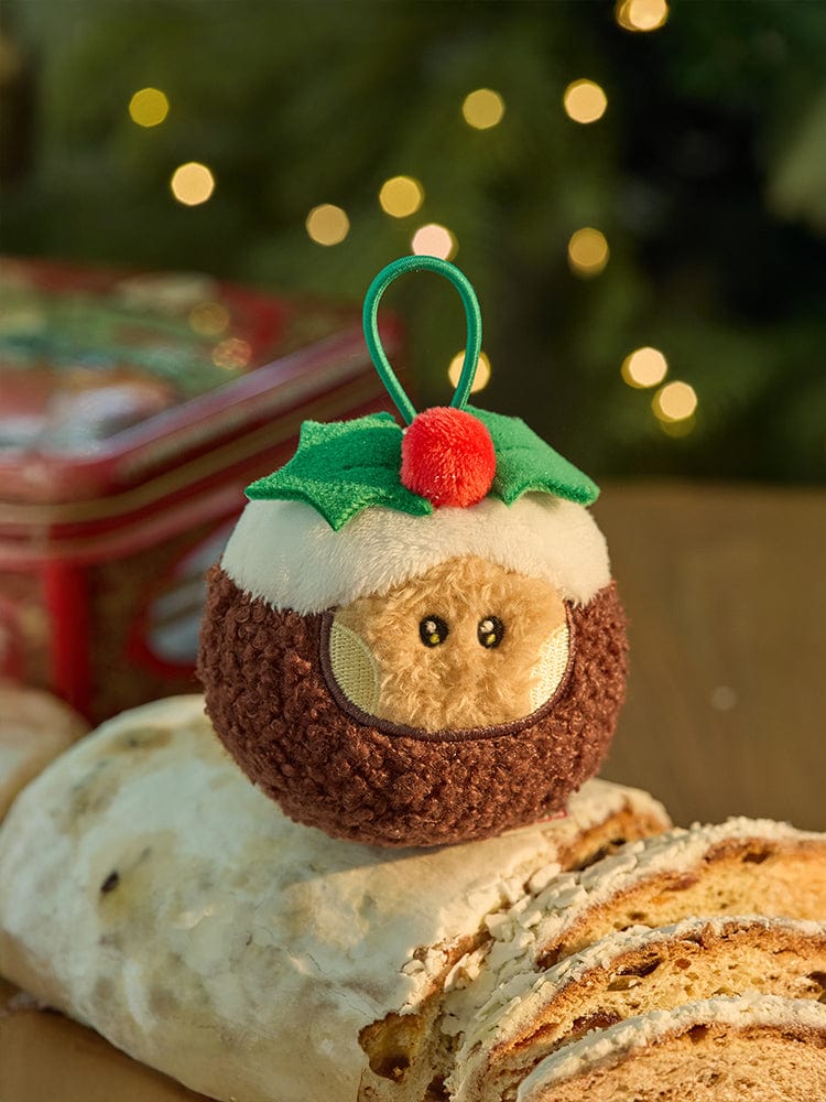 BT21 SHOOKY mini minini ORNAMENT PLUSH KEYRING PETITE HOLIDAY : porte-clés plush SHOOKY sur décor Noël, sapin flou.