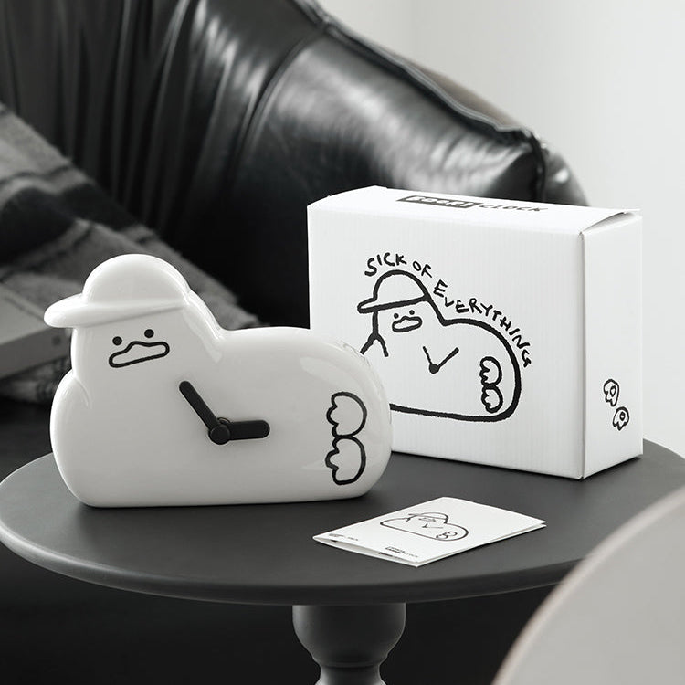 BT21  Sebong Rama + B-Mix Buri Ceramic Watch, figurine et montre BT21 sur plateau noir, boîte cadeau en arrière-plan.