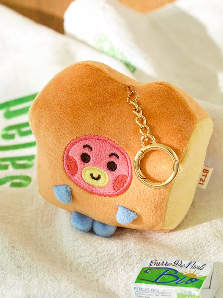 BT21 TATA BABY PLUSH KEYRING BAKERY SHOP : porte-clés peluche TATA V de BTS sur fond emballage LINE FRIENDS.