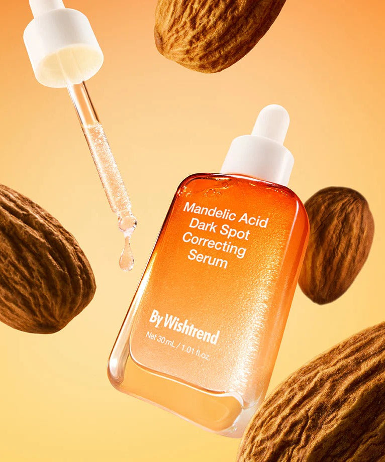 Sérum anti-taches BY WISHTREND Mandelic Acid Dark Spot Correcting Serum 30ml avec pipette et amandes en arrière-plan.