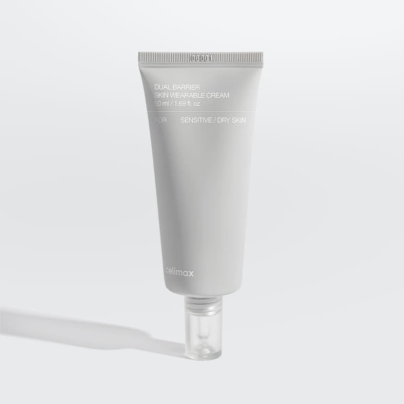 Décris l'image en français : CELIMAX Dual Barrier Skin Wearable Cream 50ml, tube crème blanc sur fond clair, marque CELIMAX.