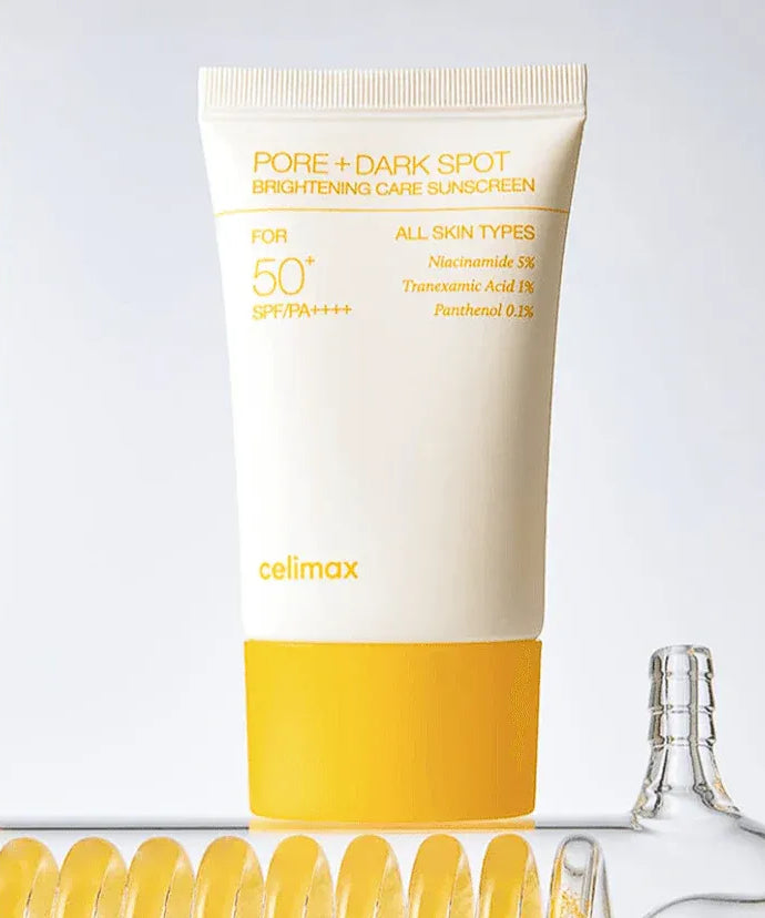 CELIMAX Pore Dark Spot Brightening Care Sunscreen 50ml sur fond clair, flacon et éléments jaunes—décrivez l’image en français.
