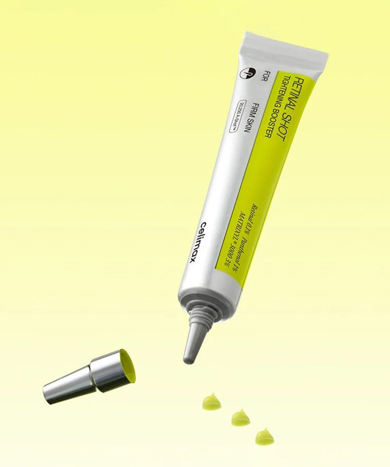 CELIMAX Retinol Shot Tightening Booster 15ml de CELIMAX, tube sur fond jaune, gouttes de texture verte.