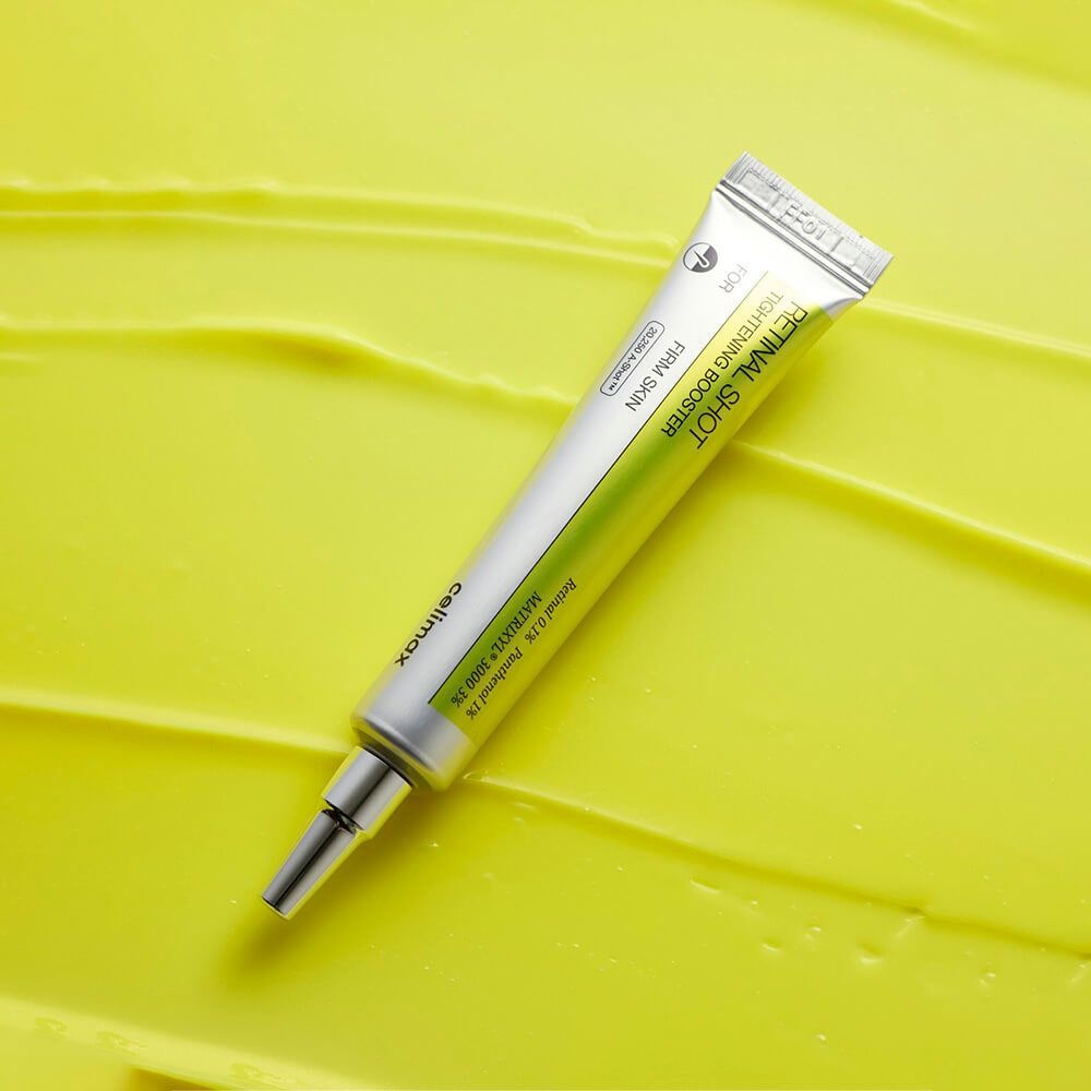 CELIMAX Retinol Shot Tightening Booster 15ml, tube de soin marqué sur fond jaune lime, rendu produit en studio.