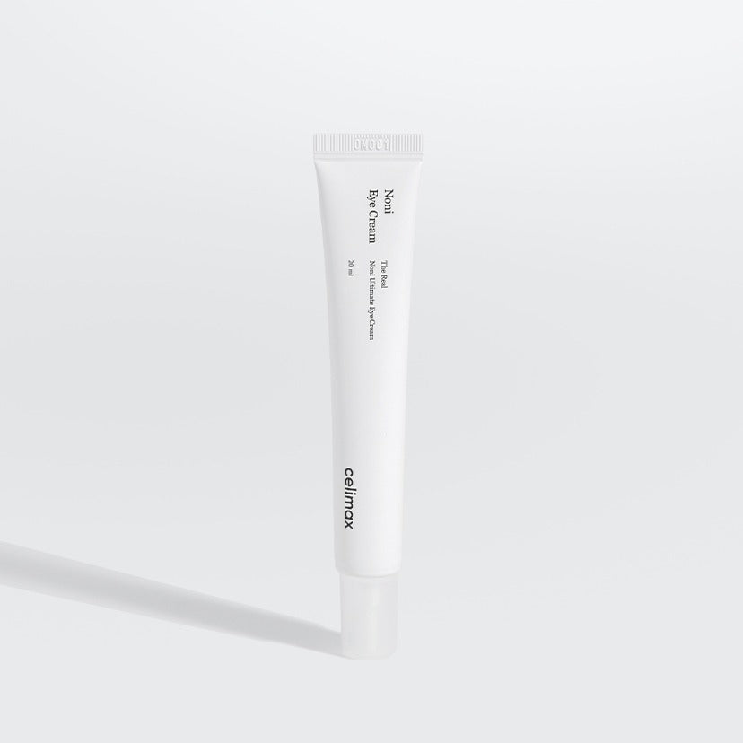 CELIMAX The Real Noni Ultimate Eye Cream 20ml : tube crème contour des yeux sur fond blanc, marque CELIMAX, éclairage studio.