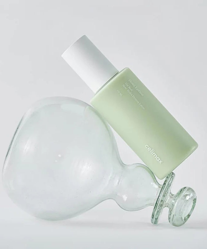 CELIMAX The Real Nino Hydra Firming Lotion 150ml sur bouteille en verre transparent, soin hydratant et raffermissant en 150ml.