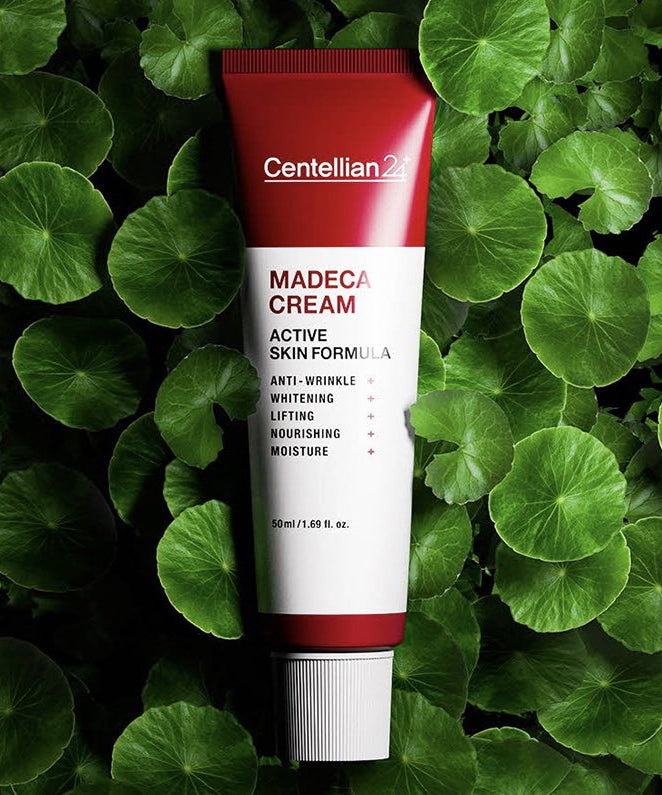 CENTELLIAN 24 Madeca Cream Active Skin Formula 50ml sur fond de feuilles vertes, crème anti-âge nourrissante et hydratante.