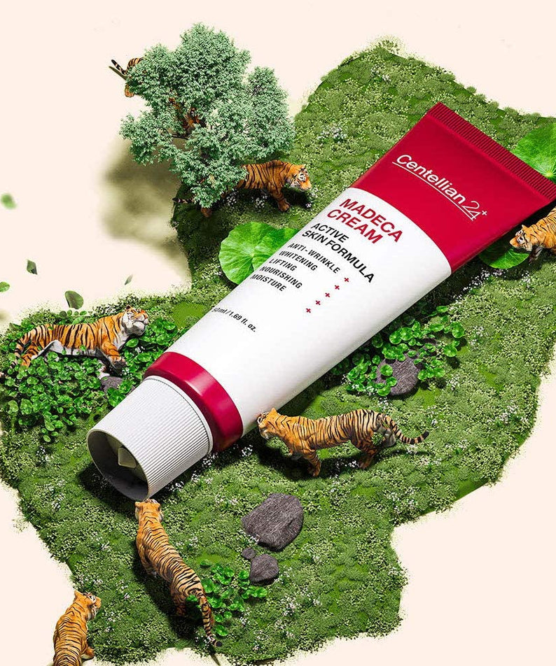 Crème CENTELLIAN 24 Madeca Cream Active Skin Formula 50ml sur fond décoratif avec petits tigres et verdure.