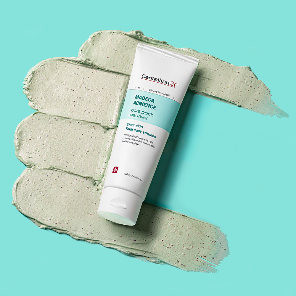 CENTELLIAN 24 Madeca Acnience Pore Pack Cleanser 120ml, tube sur crème verte, fond turquoise, marque visible.