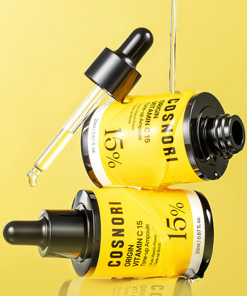 COSNORI Origin Vitamin C 15 Tone-Up Ampoule 20ml de la marque COSNORI, flacons jaune vif sur fond jaune, image produit