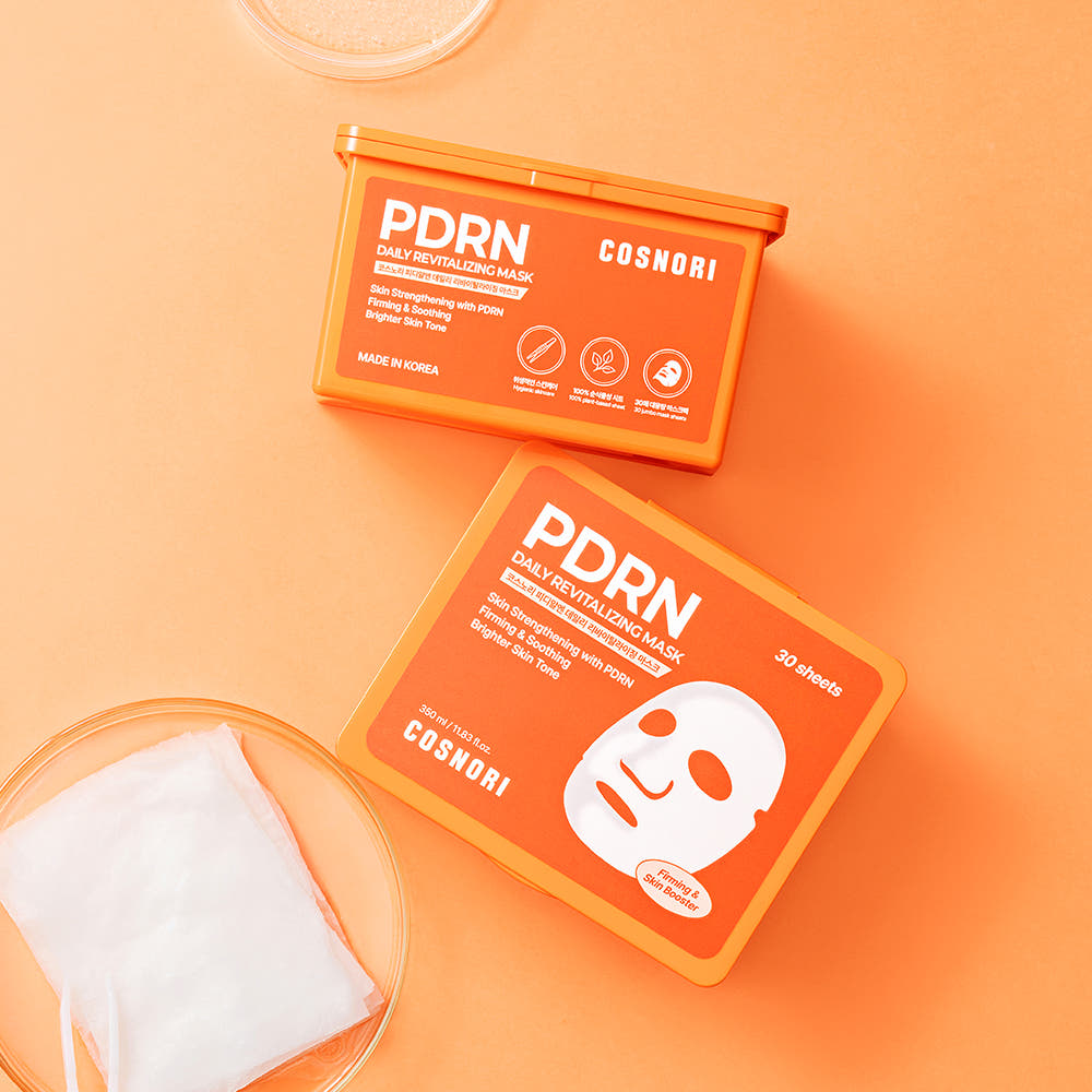 COSNORI PDRN Daily Revitalizing Mask 30 sheets, coffret de masques sur fond orange, marque COSNORI en gros plan.