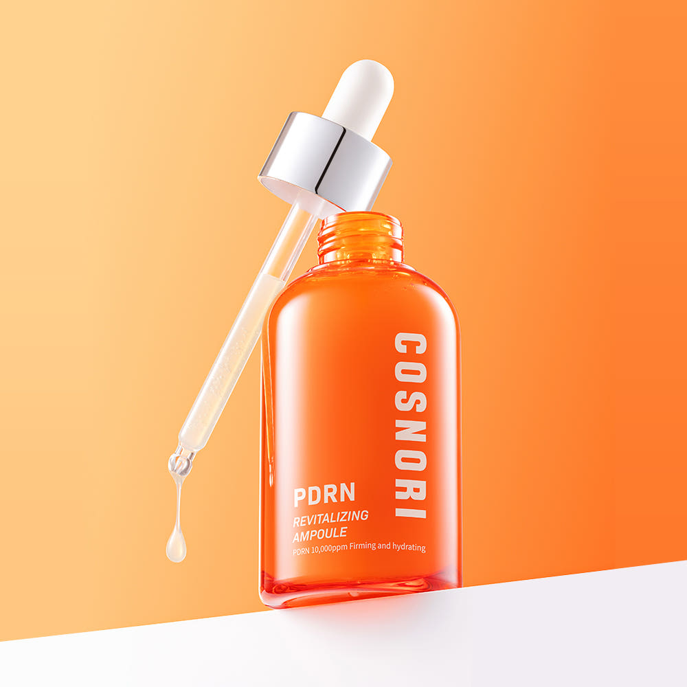 COSNORI PDRN Revitalizing Ampoule 50ml, sérum PDRN sur fond orange et beige, flacon gouttes, marque COSNORI