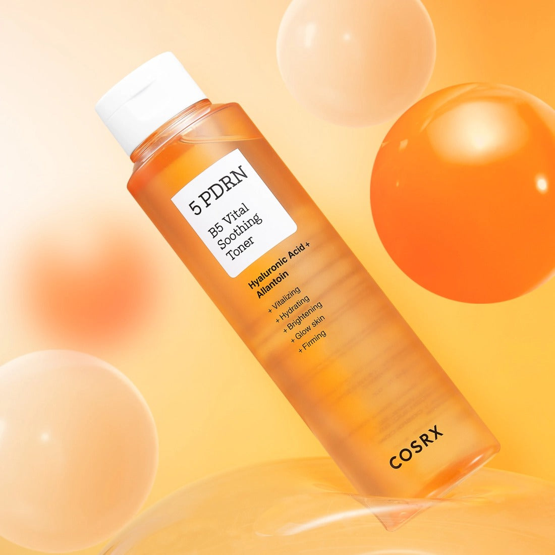 COSRX 5 PDRN B5 Vital Soothing Toner 100ml, flacon orange sur fond crème avec bulles lumineuses (visuel produit)