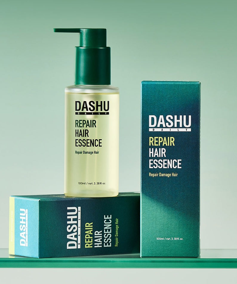 DASHU Daily Repair Hair Essence 100ml, flacon et coffret sur fond vert, marque DASHU, soin capillaire visible en studio.