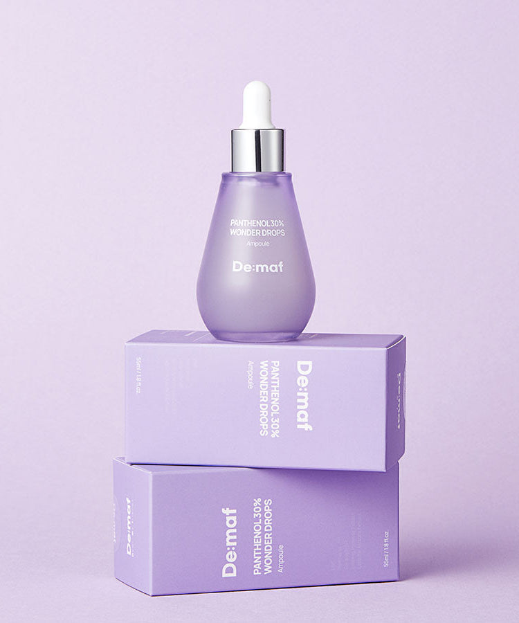 DE:MAF Panthenol 30% Wonder Drops 55ml de De:maf, flacon violet sur boîte, fond lilas, gouttes panthénol