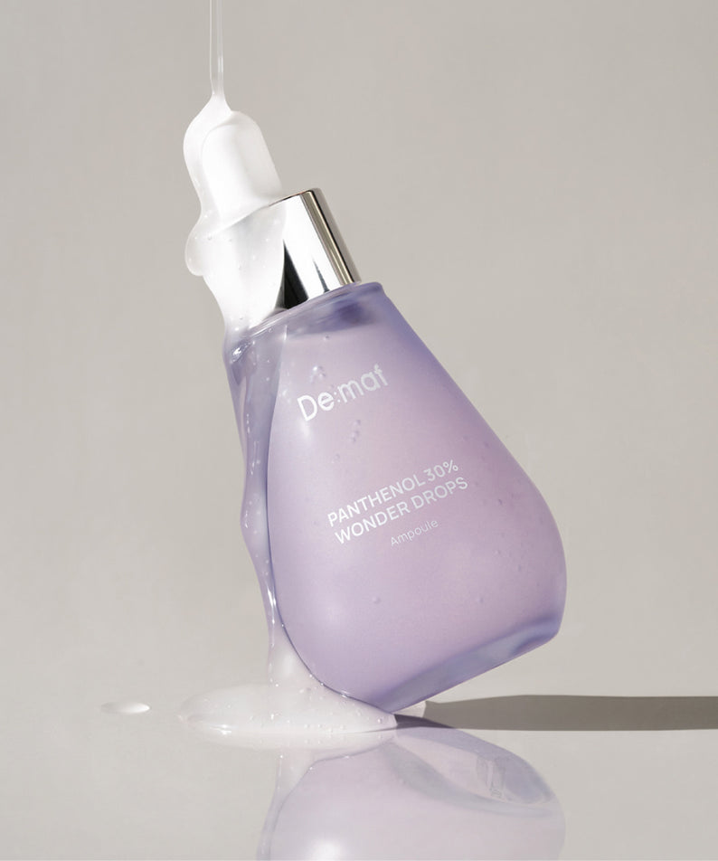DE:MAF Panthenol 30% Wonder Drops 55ml De:maf — flacon violet avec pipette, gouttes sur fond clair, visuel produit