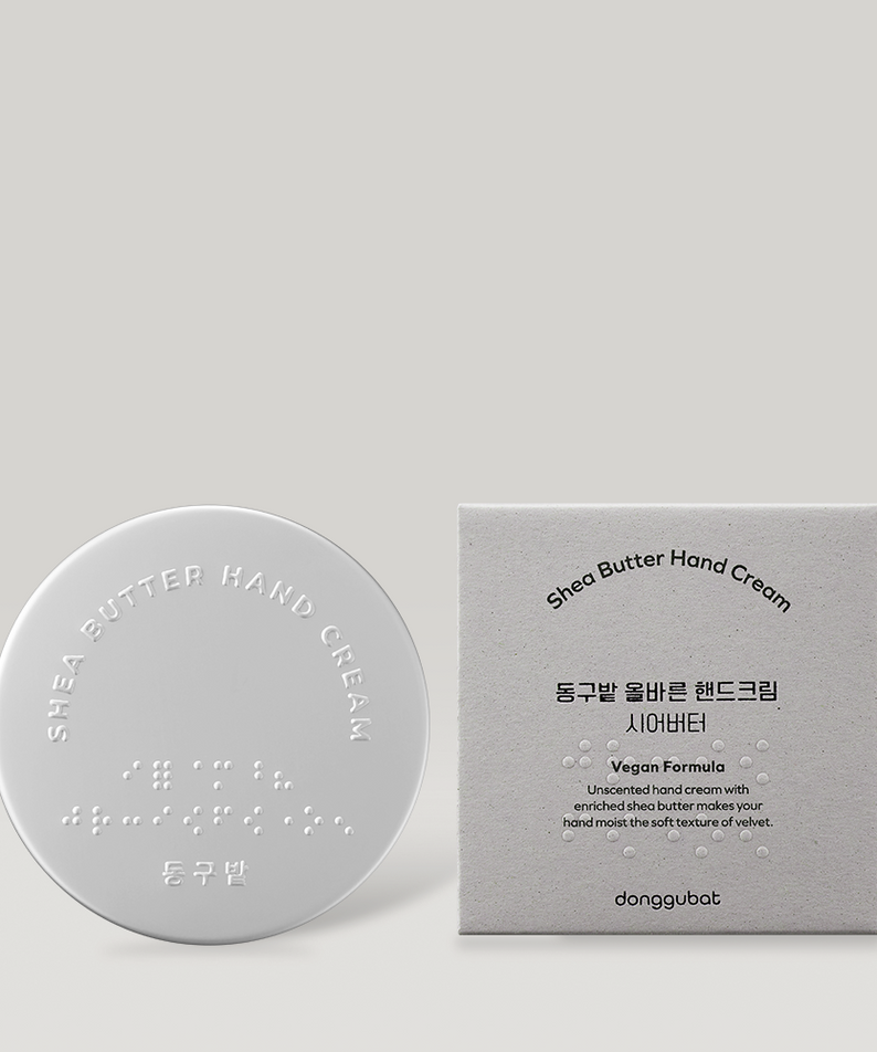 DONGGUBAT Correct Hand Cream Shea Butter, crème pour les mains posée sur fond clair avec boîte, marque visible.