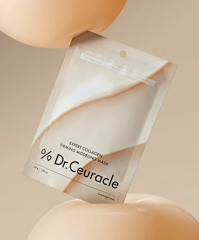 DR.CEURACLE Expert Collagen Firming Modeling Mask 30g de Dr.Ceuracle, sachet sur fond beige, contexte soin visage