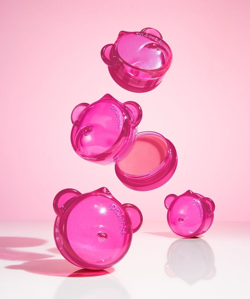 DR.JART+ Vital Hydra Solution™ Hydrating Lip Mask : masque lèvres rose en flacons transparents, fond rose lumineux