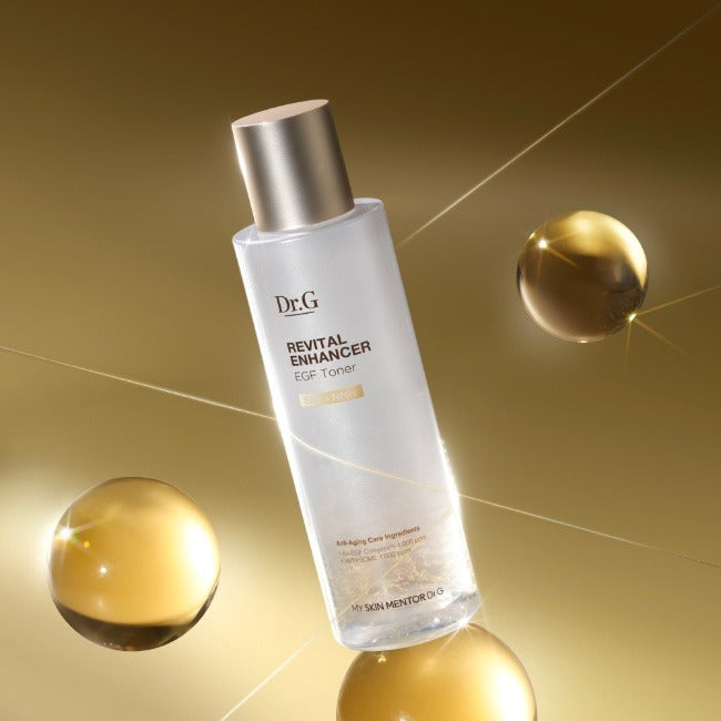 Décris l'image en français : Dr.G Revital Enhancer EGF Toner 150ml, flacon Dr.G sur fond doré, sphères cosmétiques.