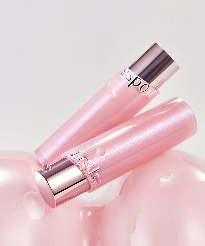 ESPOIR Bare Glow Lip Balm : baume lèvres rose brillant, packaging rose argent sur fond blanc, produit cosmétique