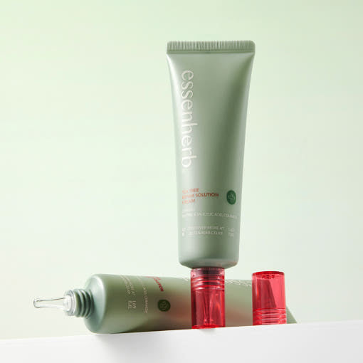 ESSENHERB Tea Tree Repair Solution Cream 50ml, crème à la texture visible, flacons verts sur fond clair, marque ESSENHERB