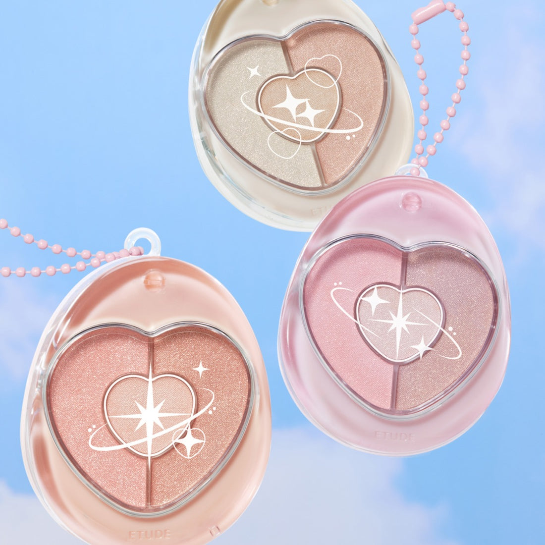 Décris l'image en français : ETUDE  Poyong Eye Maker, palette yeux en cœur rose sur fond bleu, bulles et perles