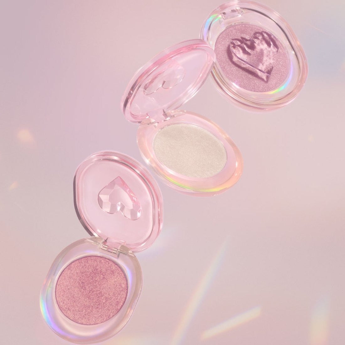 ETUDE Shooting Beam Highlighter 3g de la marque ETUDE, fard lumineux en palettes roses sur fond pastel.