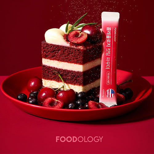 FOODOLOGY Cutting Powder de la marque FOODOLOGY, flacon rouge, dessert aux cerises et fruits sur fond rouge.
