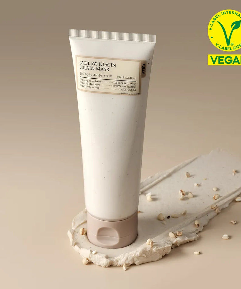 FULLY Job's tears niacin grain pack 120ml, tube crème FULLY sur fond beige, graines de Job's tears, contexte visuel produit.