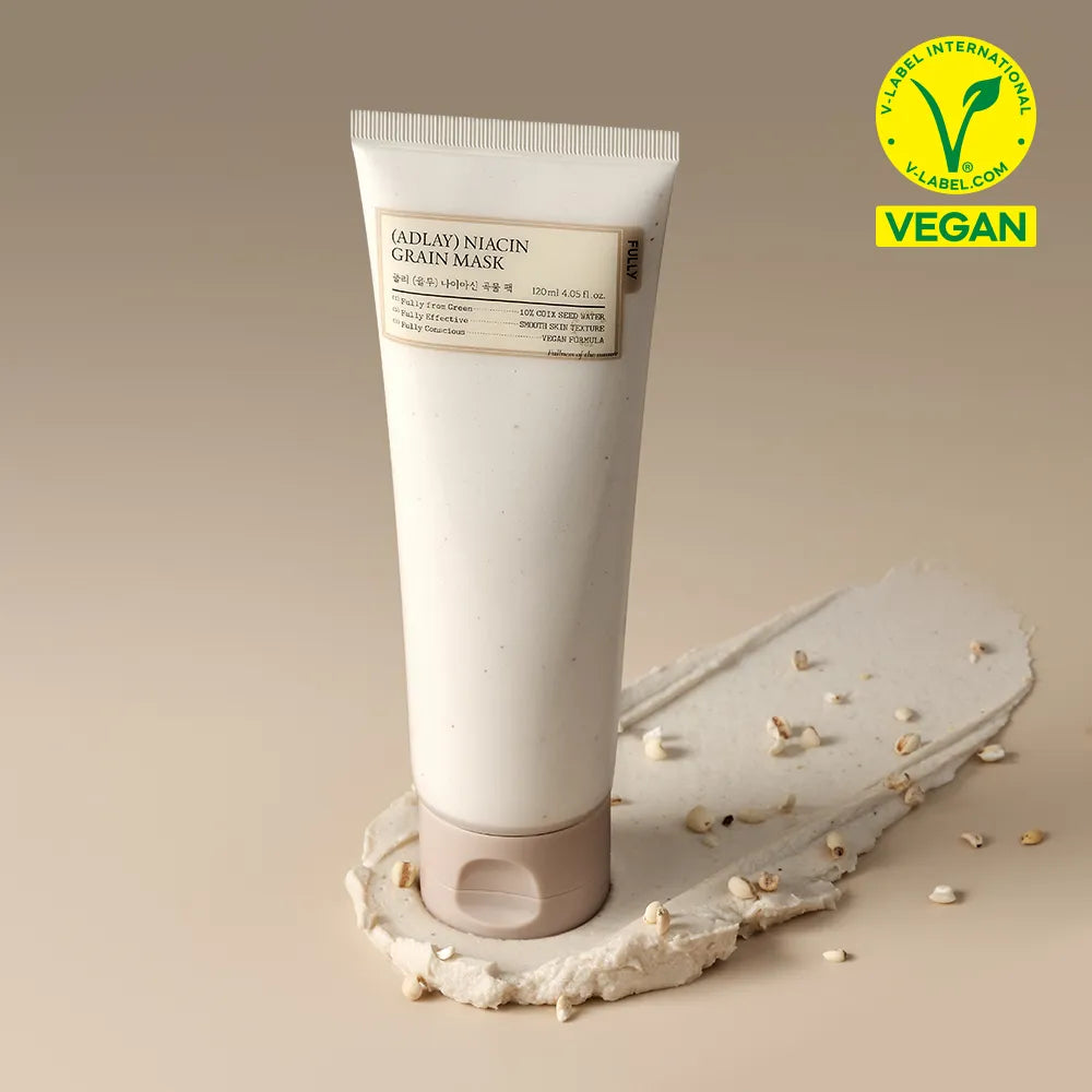 FULLY Job's tears niacin grain pack 120ml, tube crème FULLY sur fond beige, graines de Job's tears, contexte visuel produit.