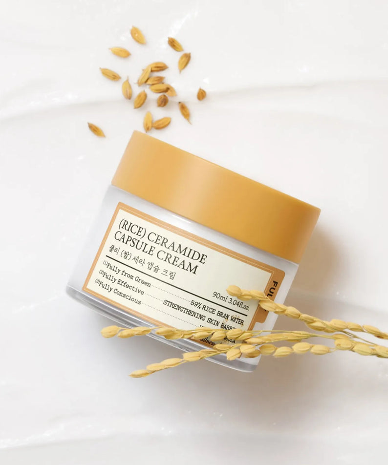 FULLY  Rice Sera Capsule Cream 90ml de la marque FULLY, pot beige sur fond blanc avec grains de riz dorés.