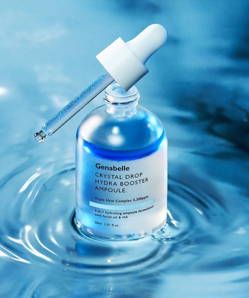 GENABELLE Crystal Drop Hydra Booster Ampoule 30ml de Genabelle : ampoule bleue sur fond aquatique, goutte de soin.