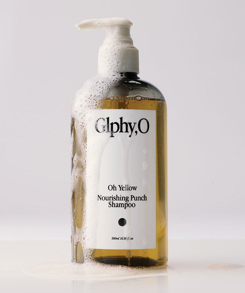 GLPHYO Oh Yellow Nourishing Punch Shampoo 500ml de la marque Glphy,O, bouteille jaune sur fond blanc, mousse visible.