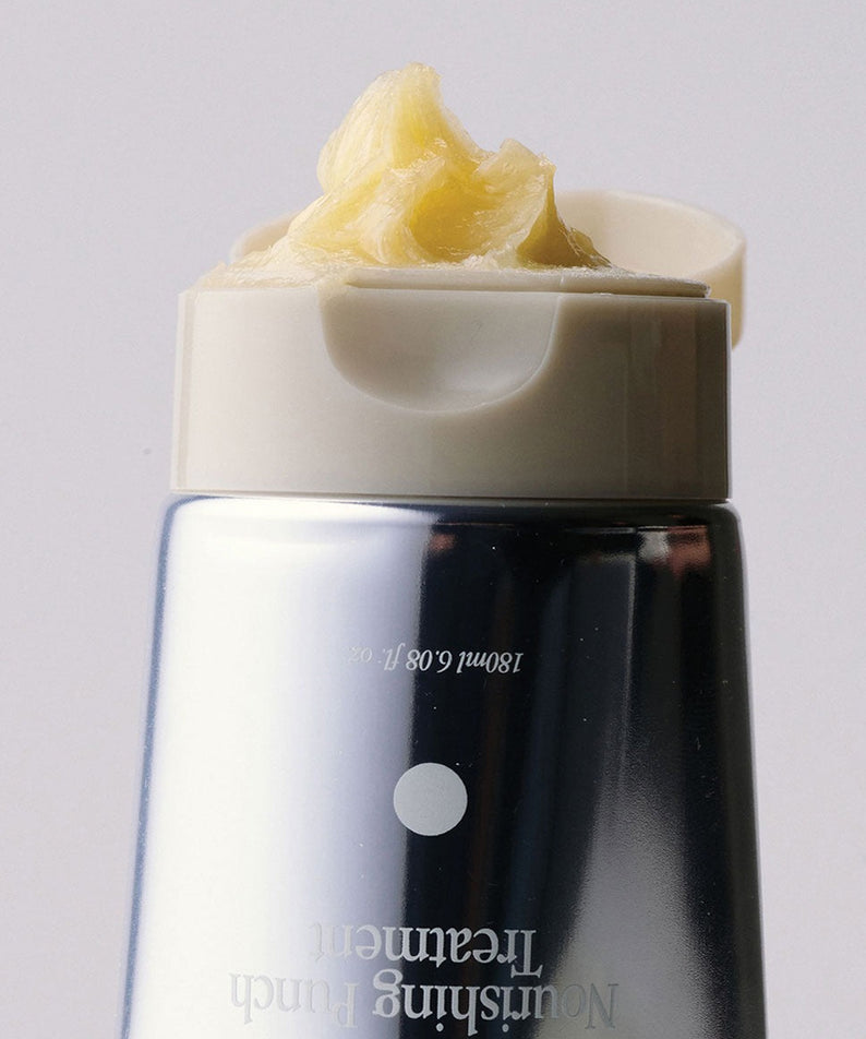 GLPHYO Oh Yellow Nourishing Punch Treatment 180ml : flacon noir et jaune, crème sur le produit, sur fond clair.