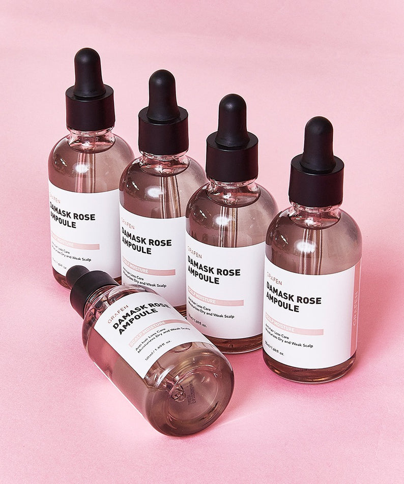 GRAFEN  Damask Rose Ampoule 50ml : flacons compte-gouttes roses sur fond rose, mise en scène cosmétique de la marque.