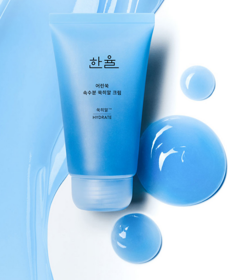 HANYUL Young Artemisia Extract Moisturizing Cream 60ml, tube HANYUL sur fond bleu avec gouttes, produit cosmétique hydratant