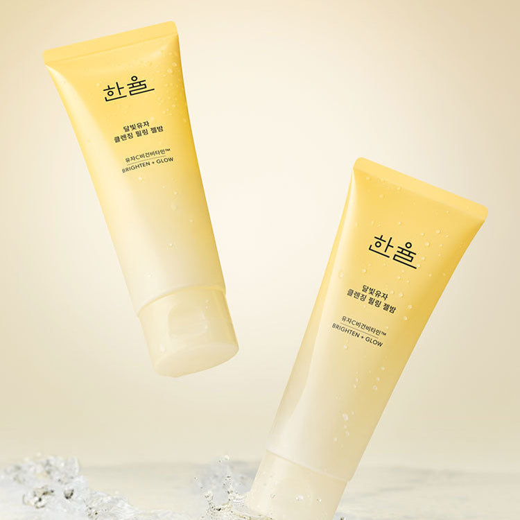 HANYUL Yuja Brightening Peeling Gel Balm Cleanser 100g : tubes jaune citrin en gel, contexte bain, marque HANYUL en visuel
